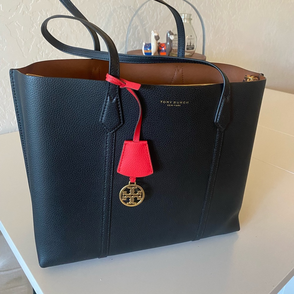 Brand new Tory Burch black leather tote bag. I’ve used it once.
